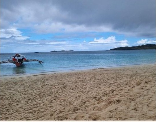 A traditional bangka resting on the shore